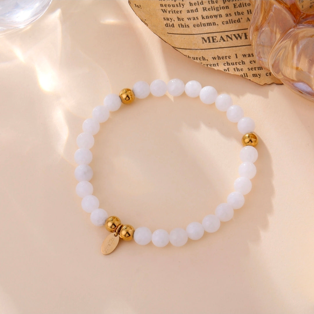 Bracelet Aurea élastique perles blanches femme